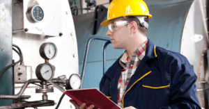 safety engineer inspecting machinery